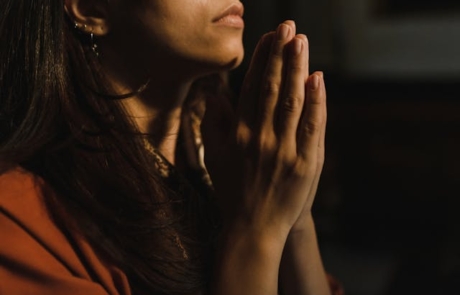 A woman prays to God